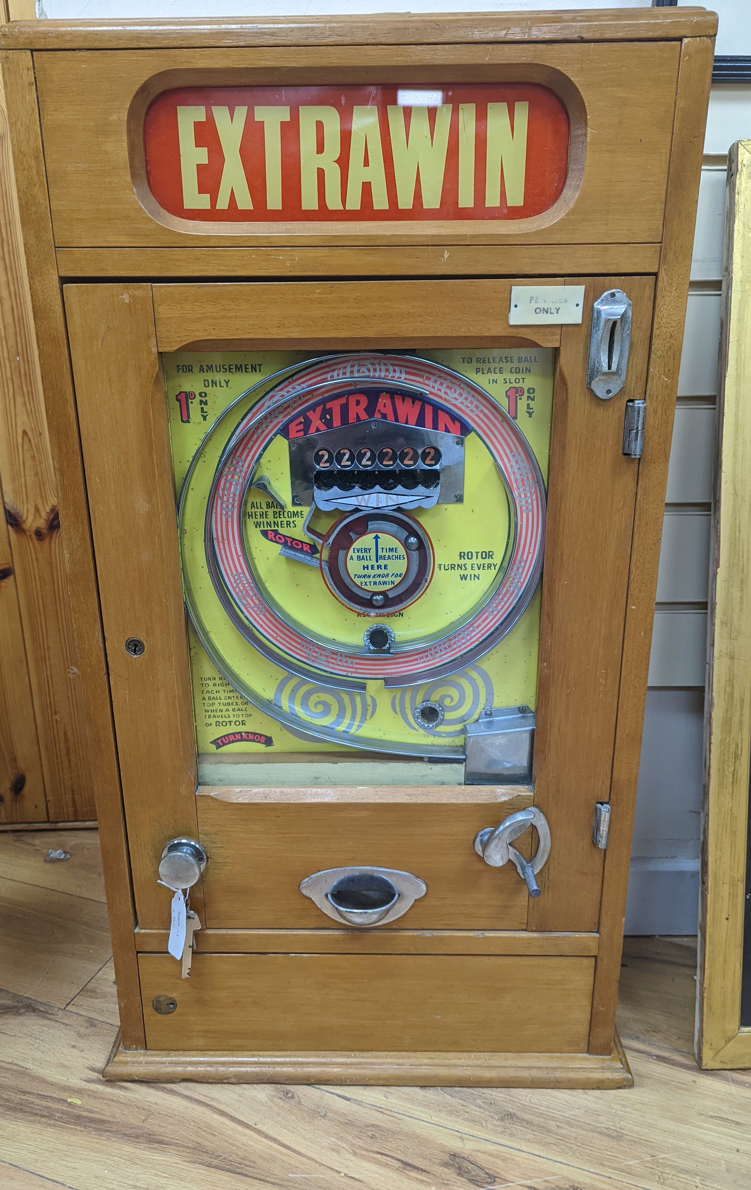 An Extrawin coin operated games machine, 87cms high.